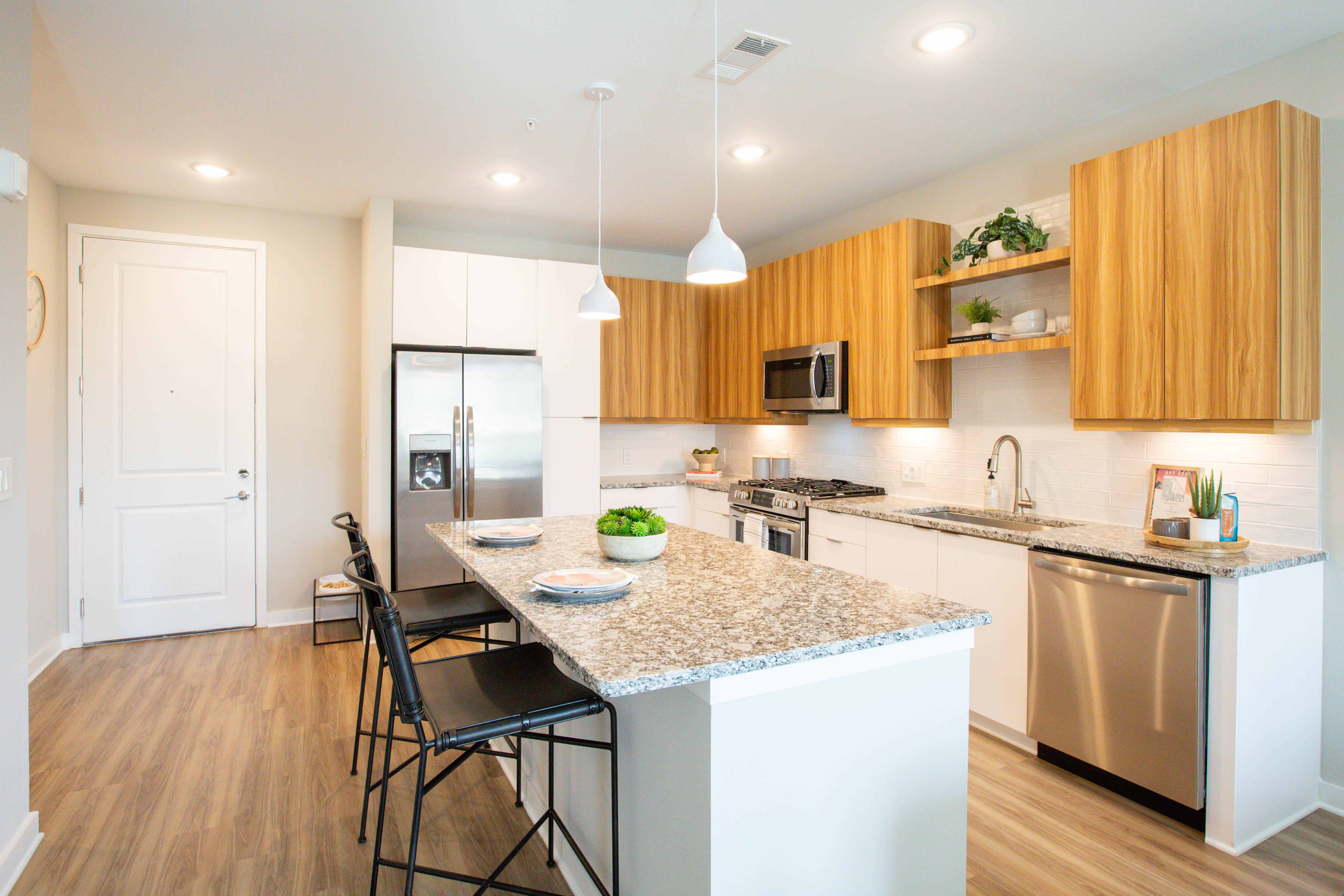 Hardwood-inspired flooring throughout residences.