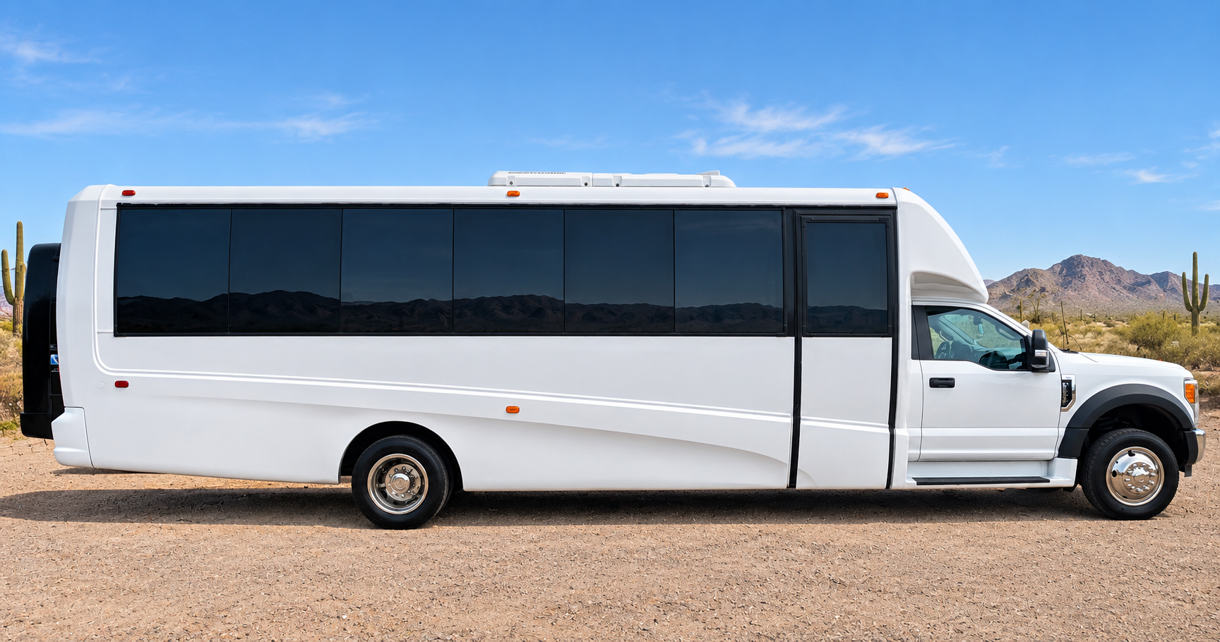 White passenger shuttle shown from the side.