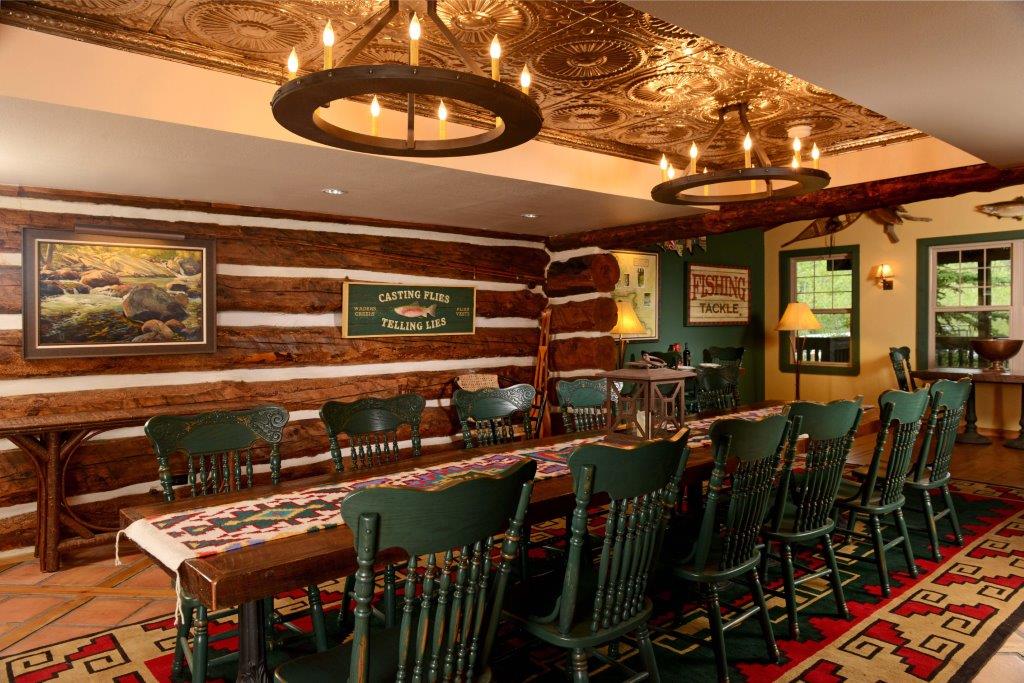 Commercial hospitality renovation completed by Reliant Construction in Colorado Springs, featuring lodge-style interior and custom wood and stone finishes.