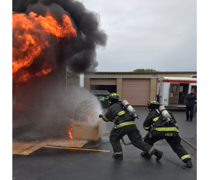SERVPRO of Hyde Park/E. Bridgeport/Bronzeville hosted a Fire Damage Continuing Education Course for insurance agents, adjusters, clients and other industry professionals in the Chicago and Bridgeport area. Our 3rd annual ’Side By Side’ burn demonstration was an opportunity to use our Burn Boxes to educate the professionals attending. We started fires in the Burn Boxes to show everyone how fast the fire spreads without sprinklers and how important sprinklers can be to help extinguish the fire.