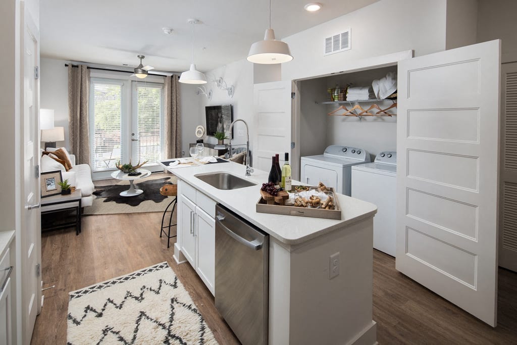 Open-Concept Kitchens with Quartz Countertops and Classic Shaker Cabinets at Echo at North Pointe Center Apartment Homes