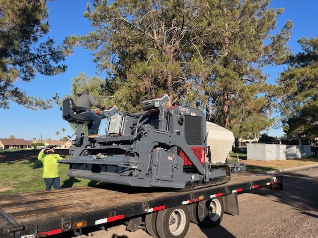 Unloading the new Dynapac Paver for first project/Mesa, Arizona/Let Pinnacle Paving handle all your pavement reconstruction projects/Call or email us for a free estimate on your next paving project