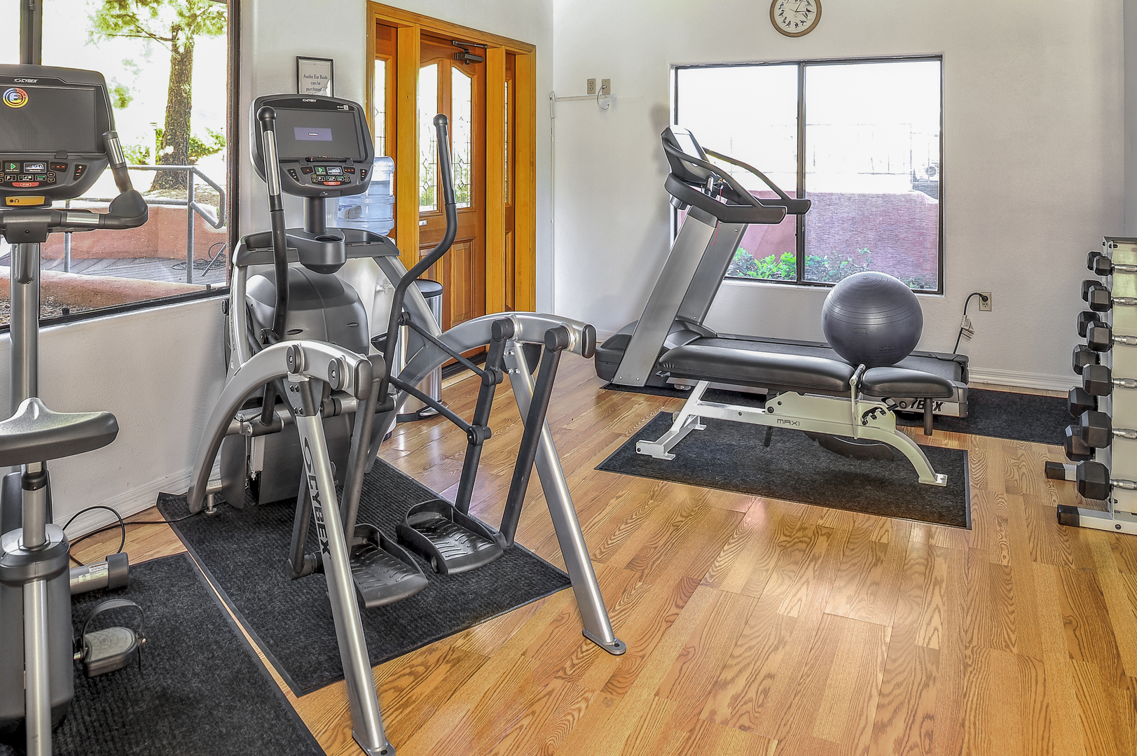 The fitness center at Bell Rock Inn. It features an elliptical, bicycle, treadmill, and free weights.