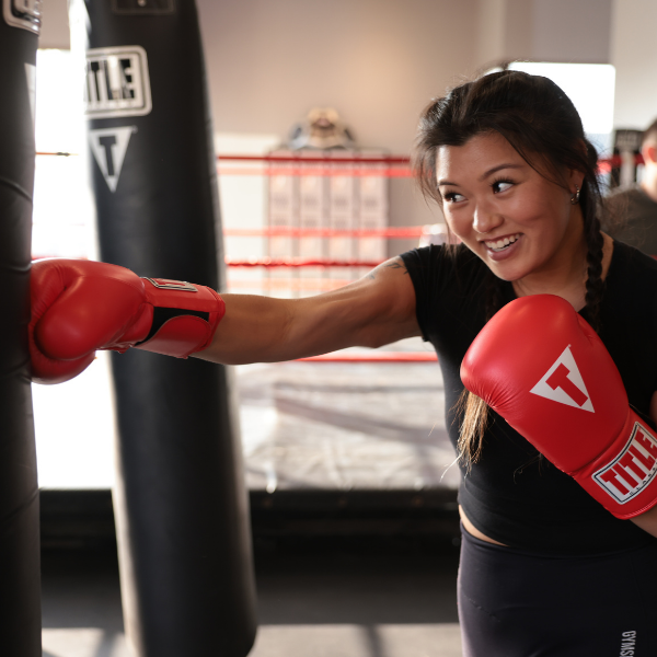 Woman training at a TITLE Boxing Club Gym TITLE Boxing Club Seattle Greenwood Seattle (206)297-5945
