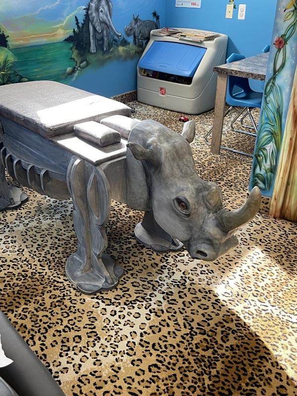 Rhino table in the jungle themed pediatric chiropractic room
