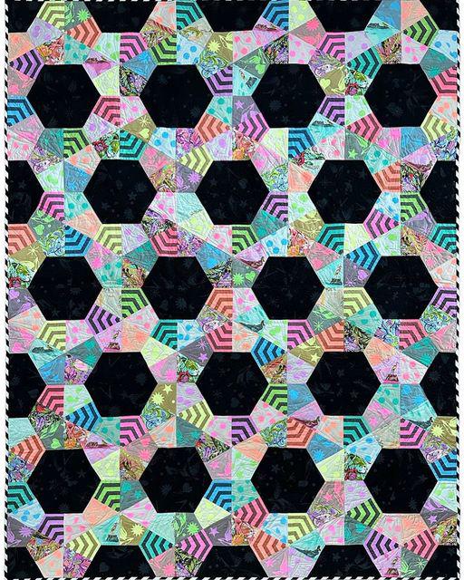 Oh my!  I already  with this quilt!!!  Wow!  Yes, we are stocking this new pattern, yes, we have the fussy cut templates and rulers.  Yes, we are getting both Everglow and Neon True Colors in soon.  Yes, we will offer kits too!