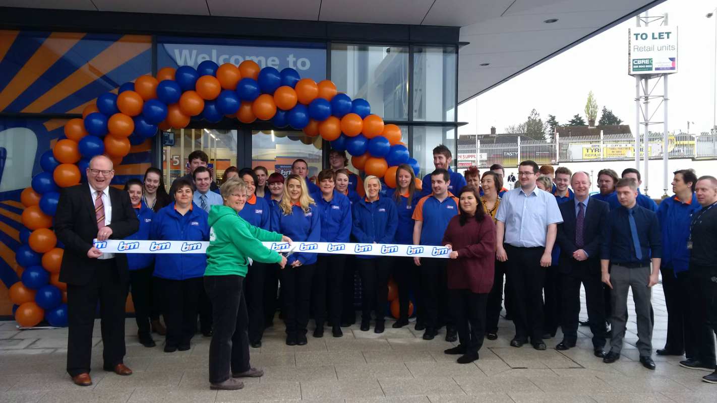 B&M Westwood being officially opened by Cynthia Cherry, Northern Ireland Regional Co-ordinator for Macmillan Cancer Care, who also received £250 worth of B&M vouchers.