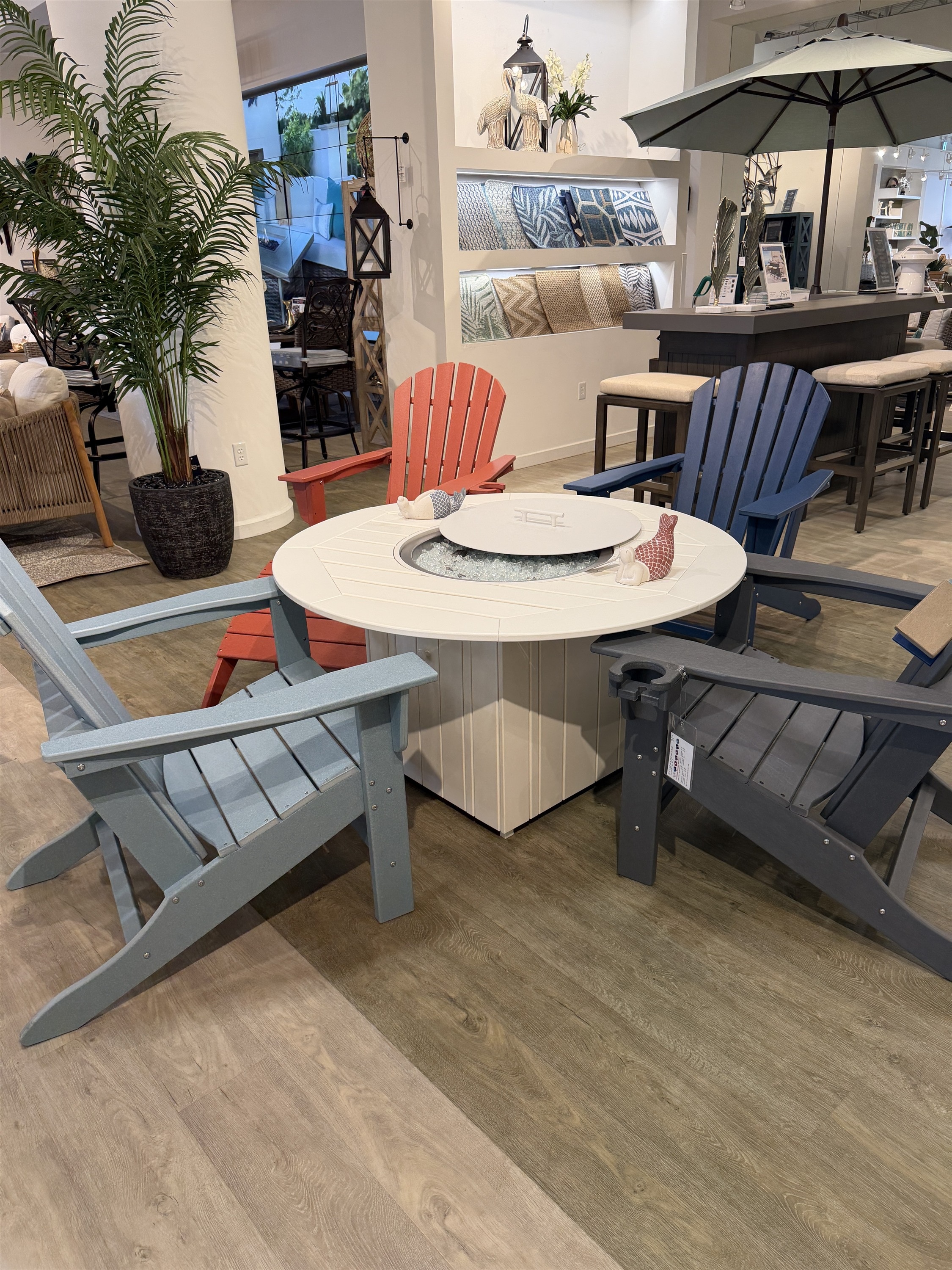 Entertain outdoors with this poly-lumber Adirondack dining set featuring a built-in cooler