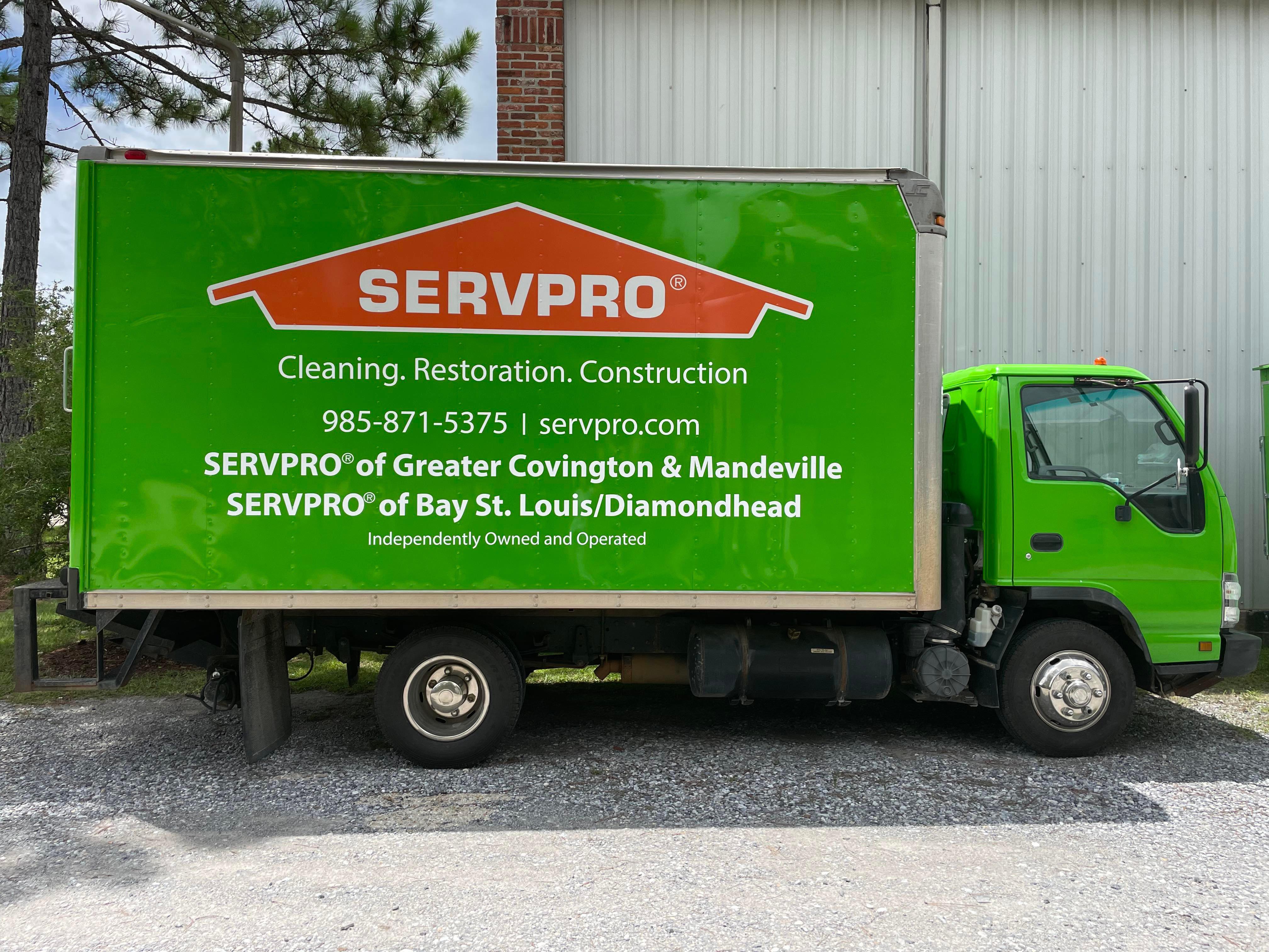 SERVPRO of Greater Covington and Mandeville green water damage mitigation vehicle.