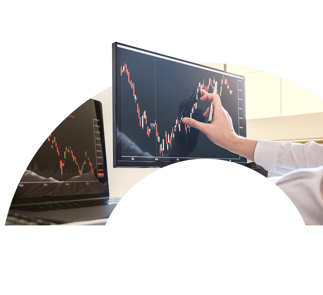 A close-up of an investment professional reviewing data on their computer displayed in the curve of a large letter O.