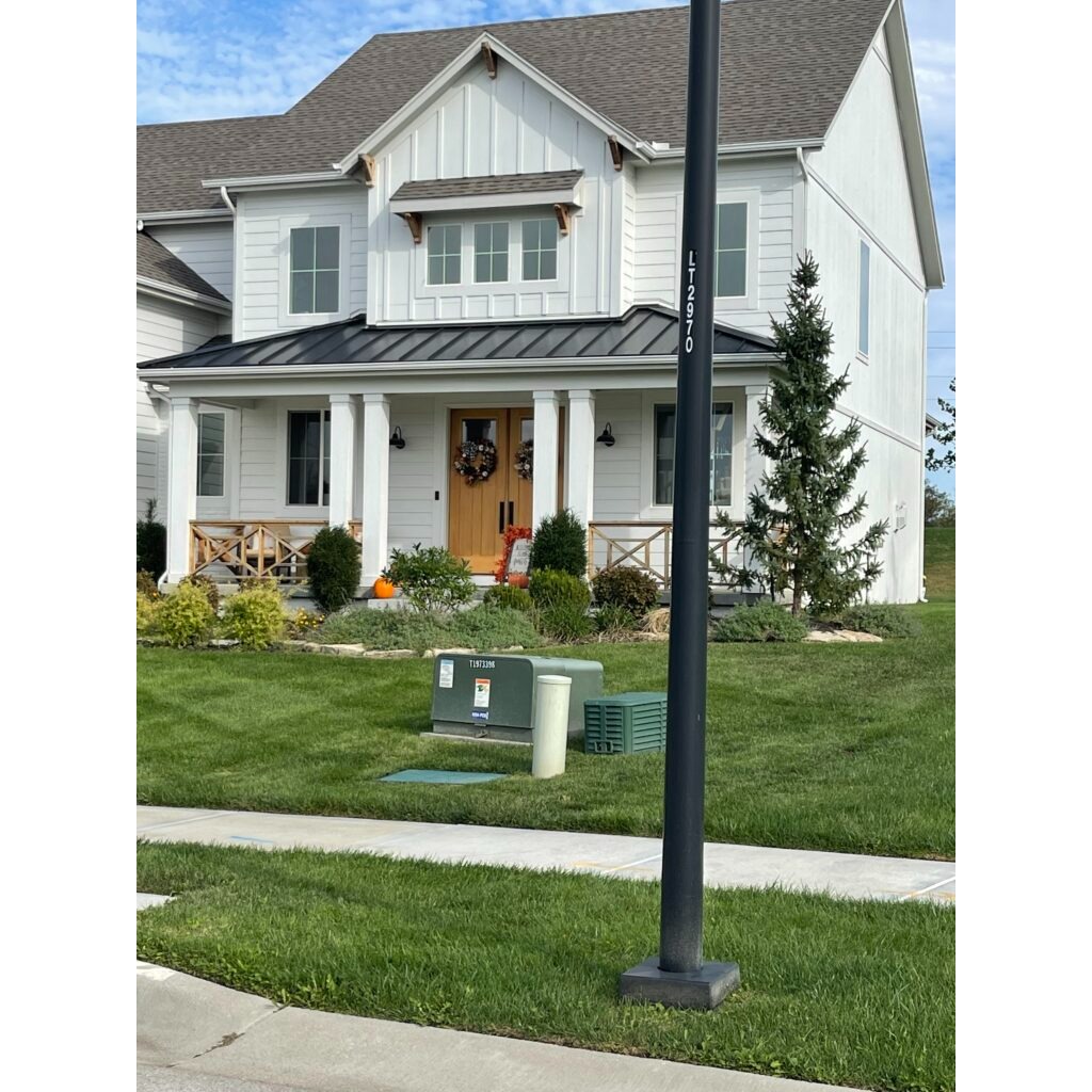 Well-maintained home exterior in Kansas City with clean siding and landscaping. Expert exterior property maintenance for homeowners and property managers.