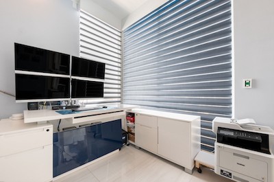 You can’t go wrong with the sleek appearance of dual sheer shades! Our unique dual sheer shades come in a variety of stunning color options and fabrics to complement your home’s interior. Not only do these modern shades completely elevate this home office, but they also protect against distracting s