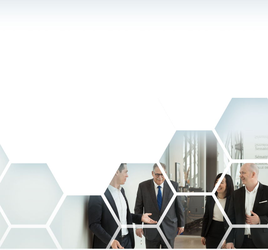 The Winestock Childerhouse team walking down an office hallway.