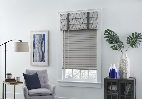 Looking for an elevated, classic way to style your living room? We’ve got you covered! Combining window treatments is one of the easiest ways to dress up any space, and we absolutely love this combination of our patterned roman valance with our classic wood blinds. We are proud to serve the Bluffton