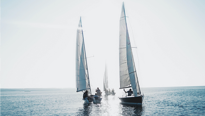 Sailboats on calm water.