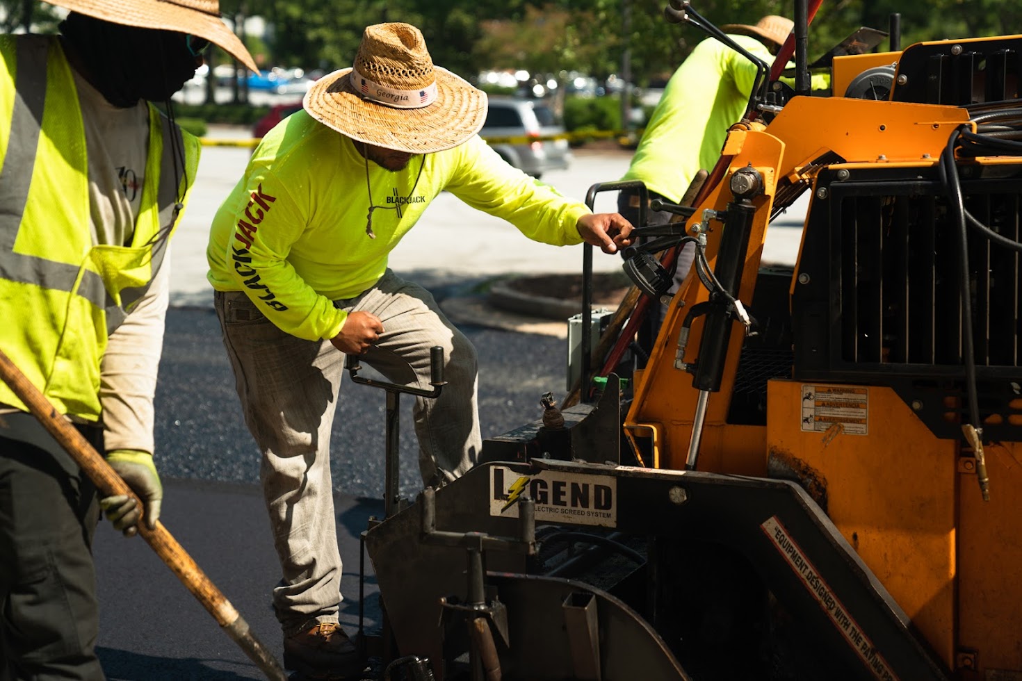 Men performing asphalt paving