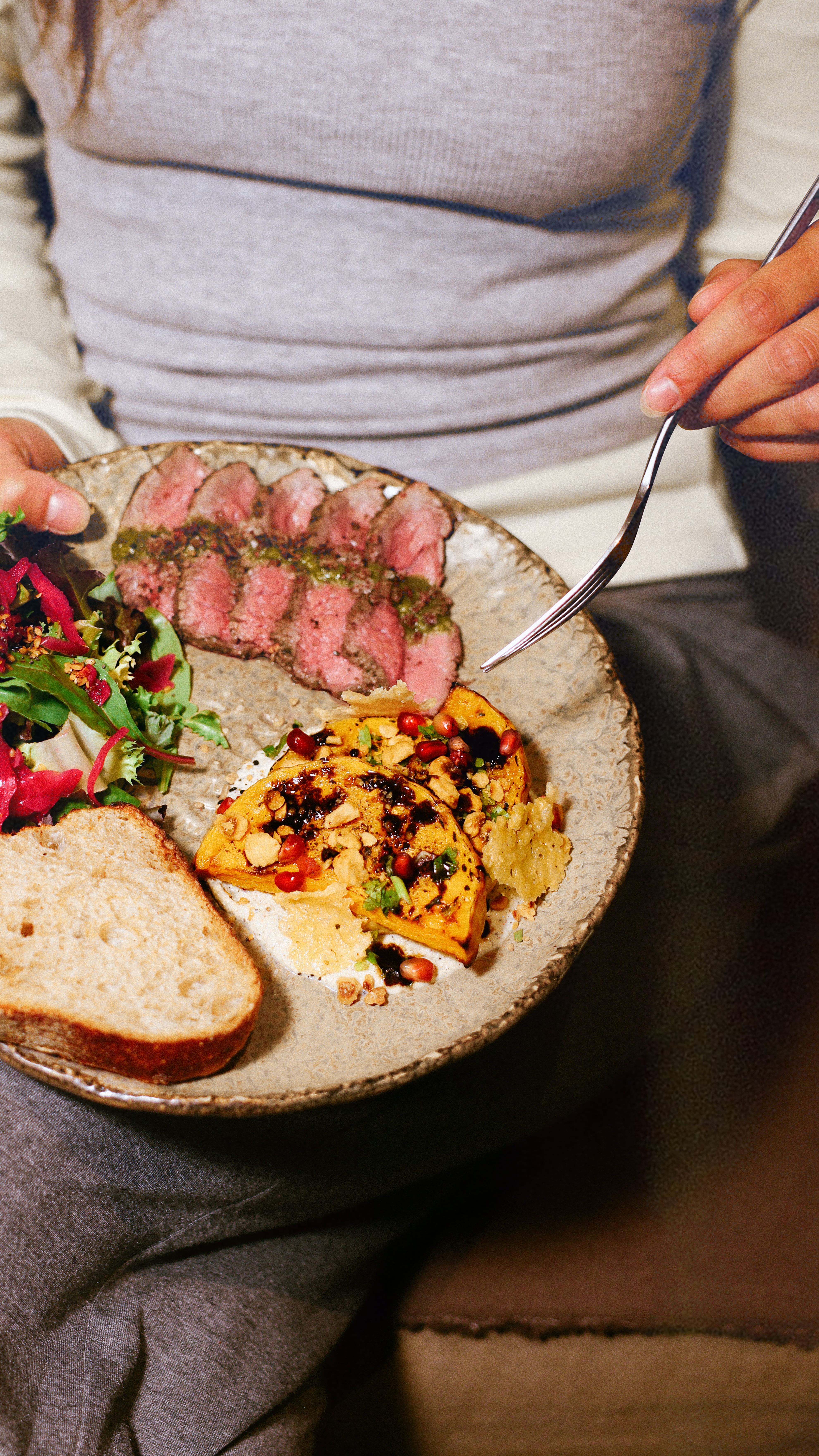 Steak Chimichurri with Roasted Pumpkin & Ricotta, salad and bread.