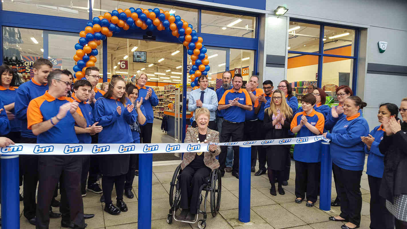 The new Crawley store being opened by The Mayor of Crawley Councillor Ms Chris Cheshire and Representatives from Sense who gratefully received £250 worth of B&M vouchers.