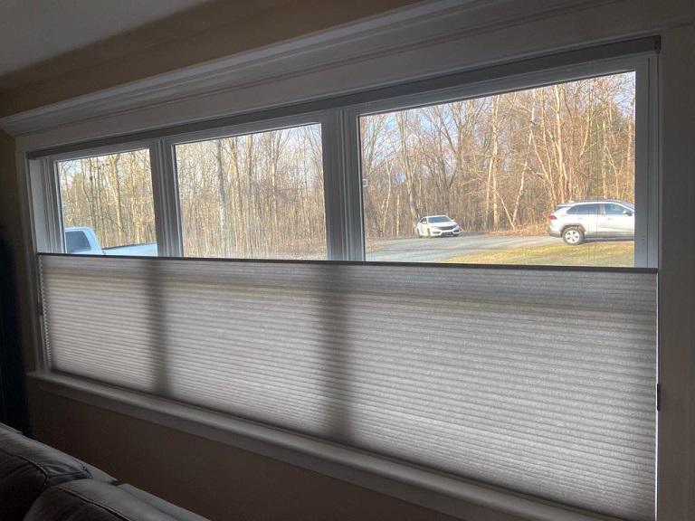 Our Top-Down, Bottom-Up Honeycomb Shades are an excellent way to upgrade your window coverings without losing light control or privacy. Check out how great they look in this house in Troy.