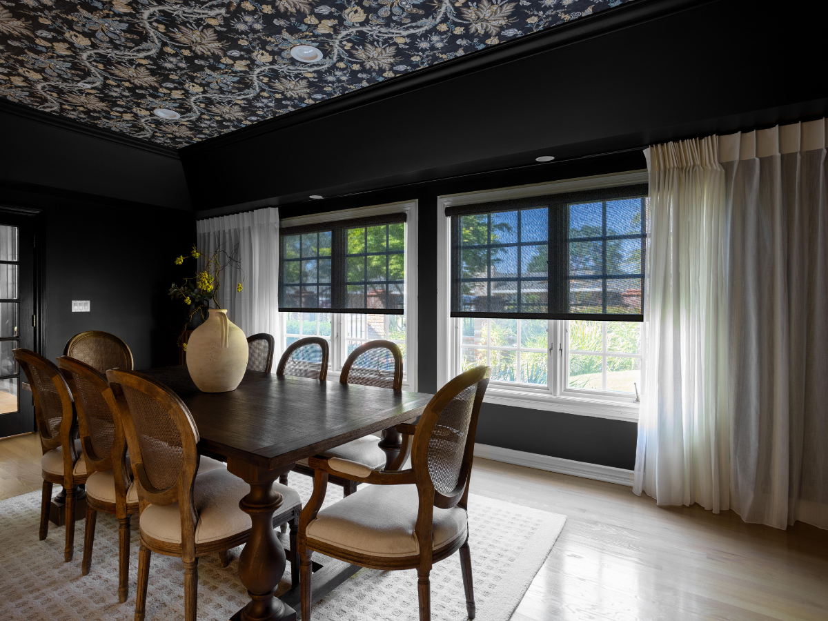 Embrace the dark and moody trend with our stylish window treatments. Our energy efficient solar shades not only enhance your décor but also keep your dining room comfortable for entertaining guests.