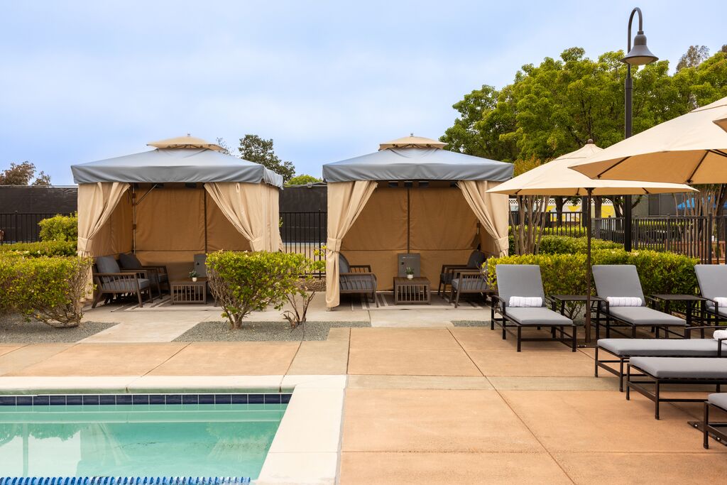 Your own corner of the afternoon — shaded, private, and right at the water's edge.