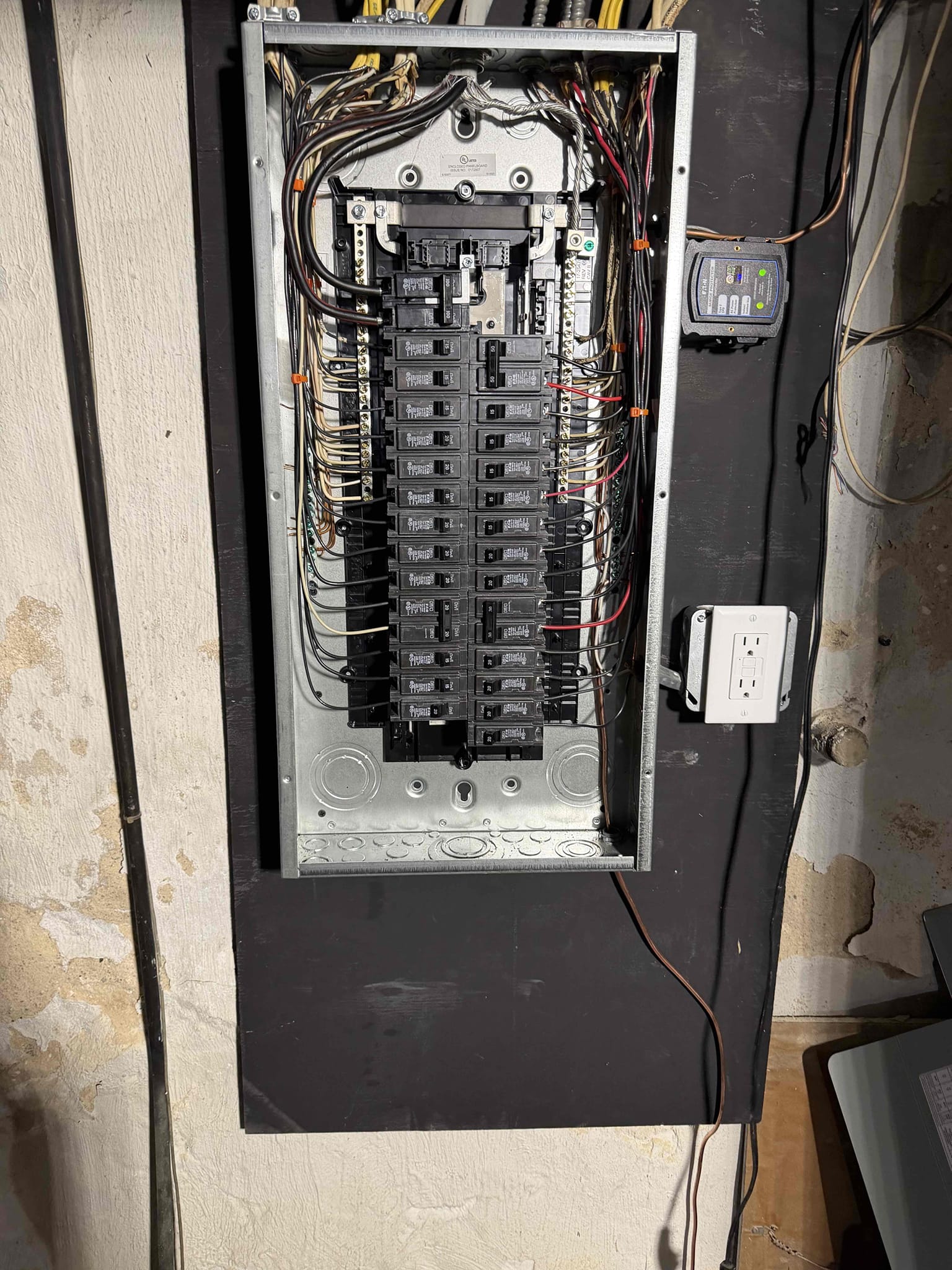 Thomas Edison Electric completed this residential breaker panel upgrade in a Bryn Mawr, PA basement. The fully loaded panel features neatly routed wiring and a adjacent GFCI outlet for code-compliant workbench power.