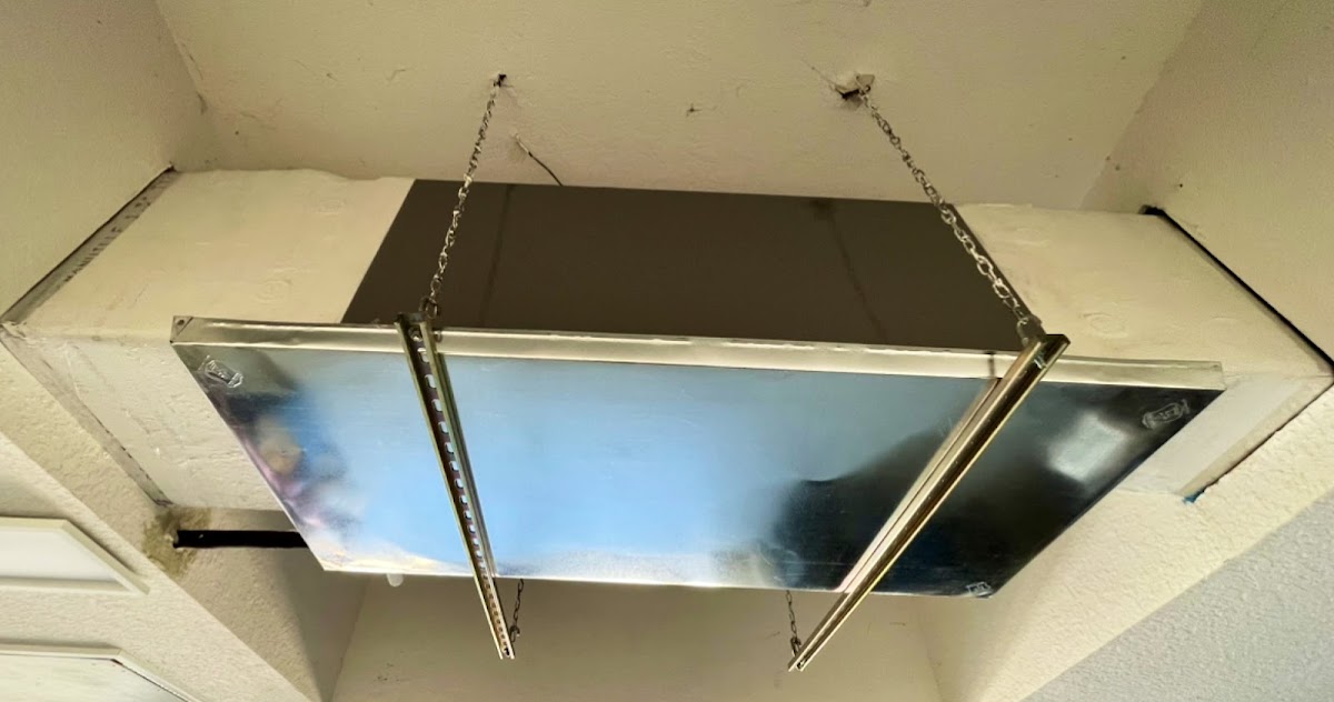 Ceiling-mounted HVAC vent and ductwork installation designed to deliver balanced airflow throughout the space.