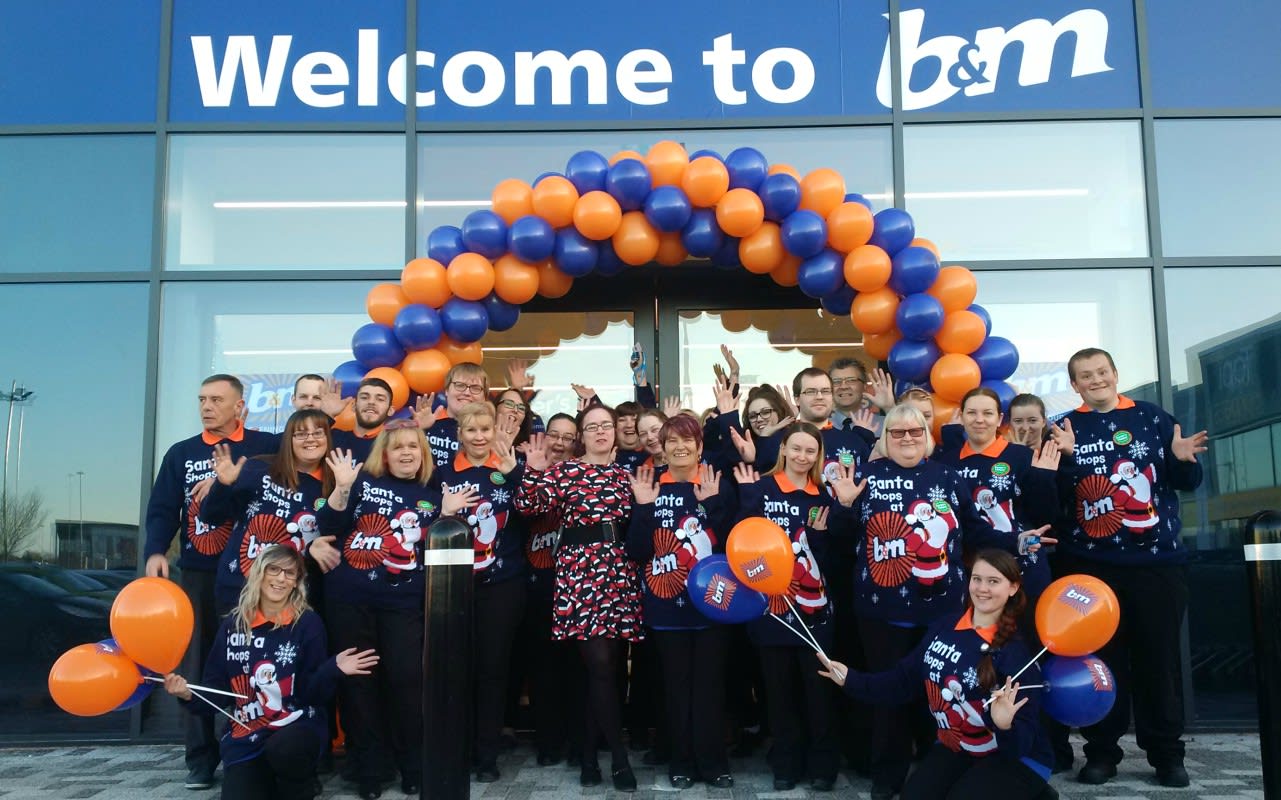 Store staff pose outside the new B&M Bargains Store at Pierpoint Retail Park, King's Lynn