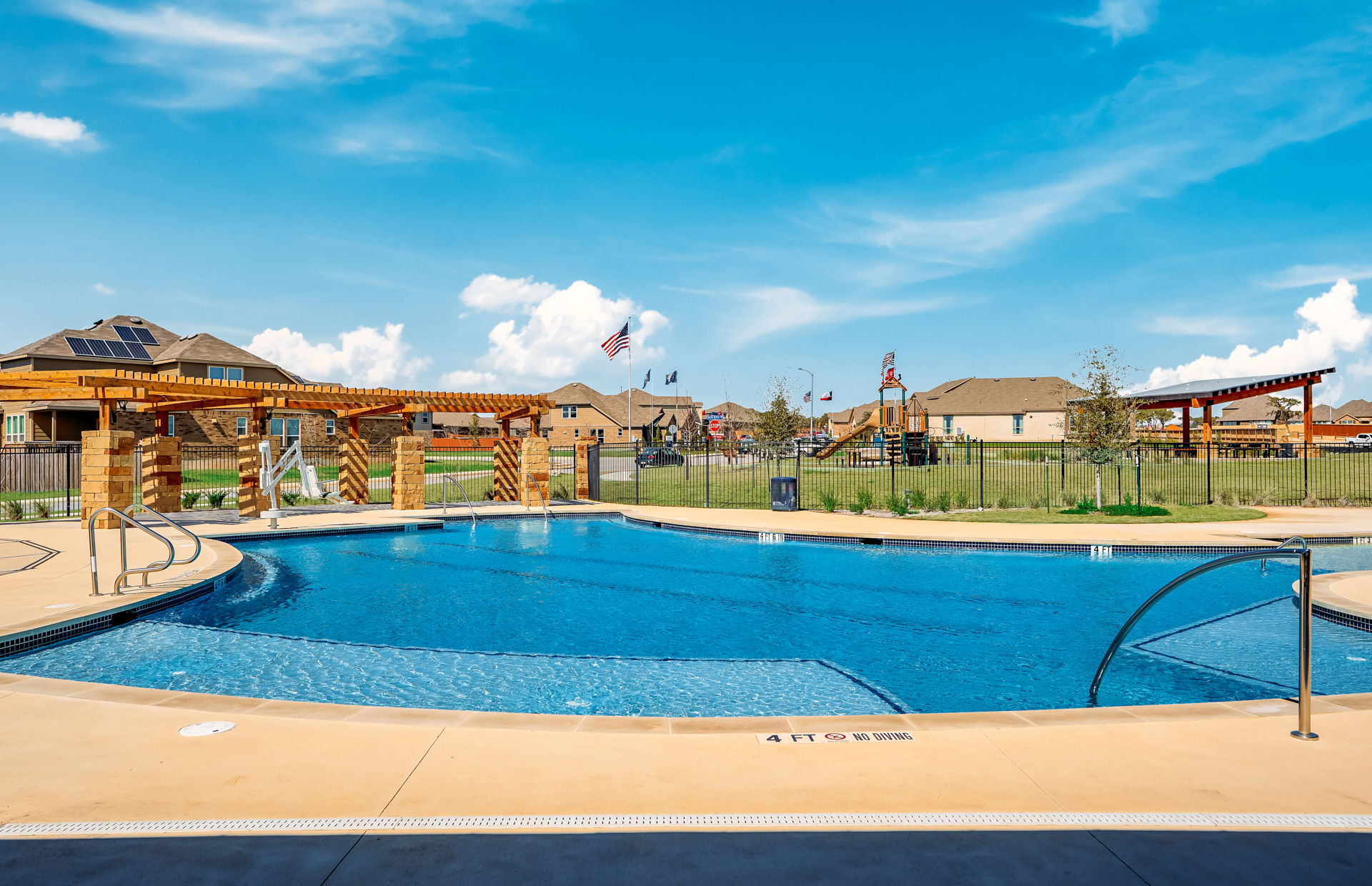 Community pool near playground and cabana at Davis Ranch new homes in San Antonio, Texas
