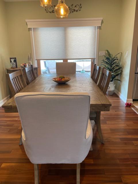 Our Wood Cornices are the perfect addition to your windows as they give an old-world elegance. We recently coupled them with Roller Shades to add to the beautiful aesthetic of this dining room in Pleasantville, New York.