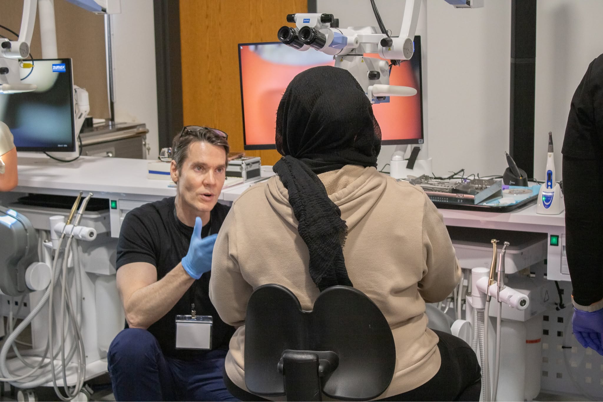 Dr. William Nudera talking to a client 