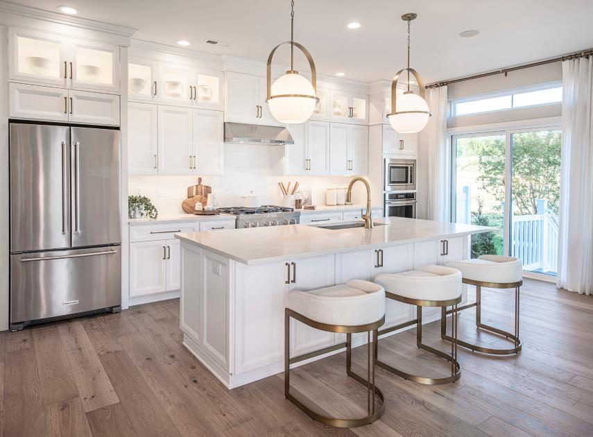 Gorgeous kitchens with large center islands, brand-name stainless steel appliances, and granite countertops