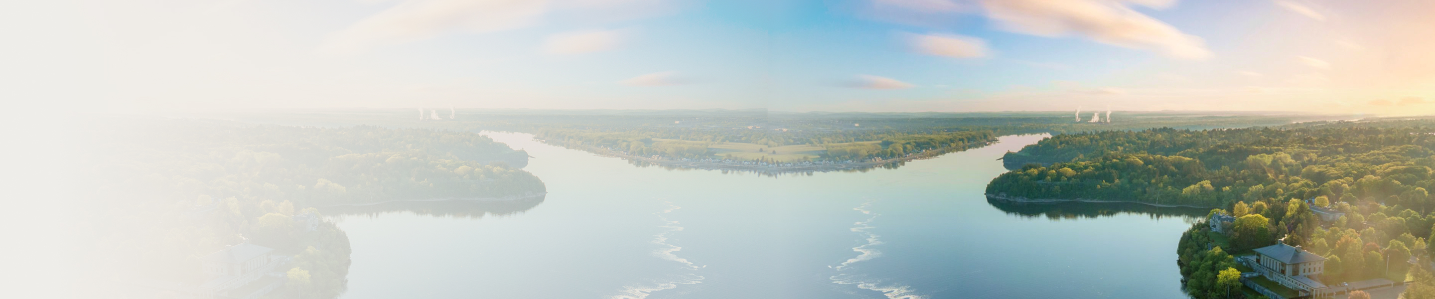 A beautiful, serene bird's eye view of a lake and surrounding forest.