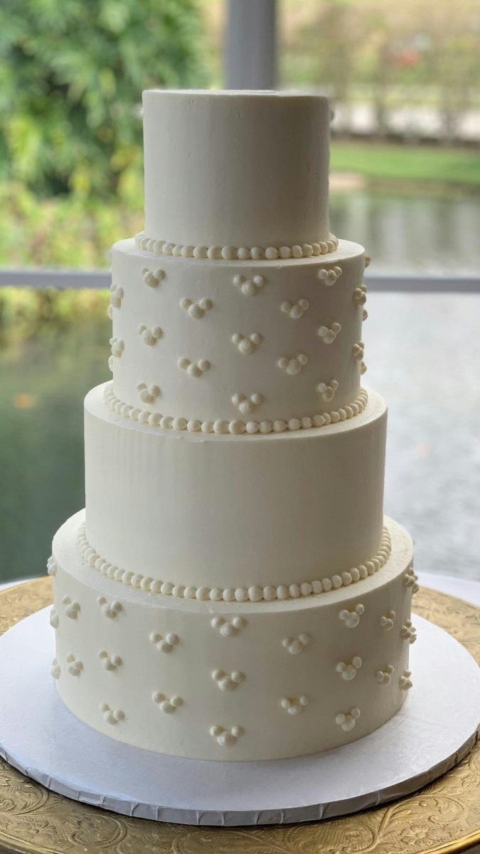 Elegant four-tier custom wedding cake. 