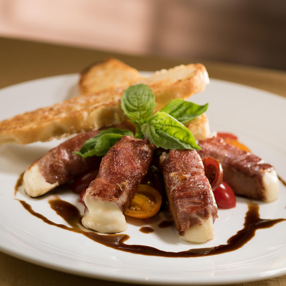 Prosciutto-Wrapped Mozzarella with Vine Ripe Tomatoes served with crisp crostini and 15-year aged ba The Capital Grille Salt Lake City (385)419-3888