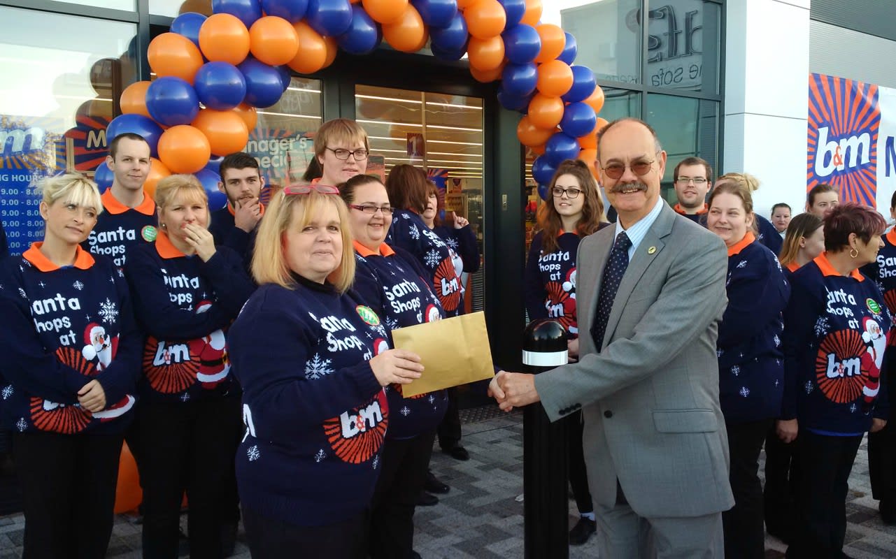 Mr David Llewellyn from Kings Lynn Hospital Radio was B&M's special guest for the day and gratefully received £250 worth of B&M vouchers, as a thank you