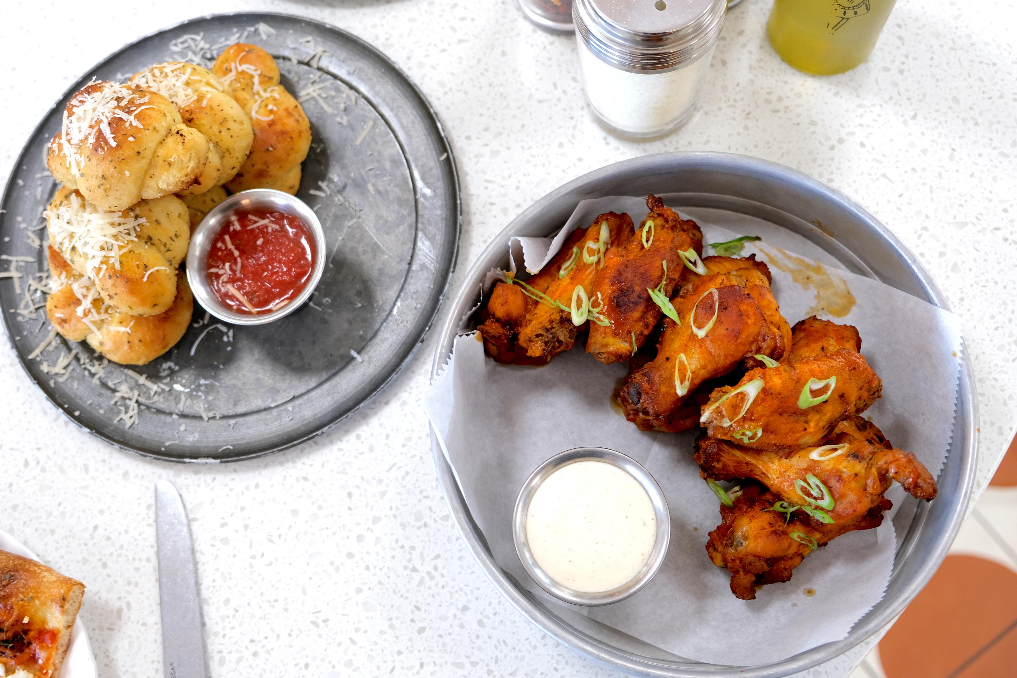 Herbed Garlic Knots, Marinara Sauce, Parmesan, Oven-Baked Wings Garlic & Parmesan Classic Buffalo Honey BBQ House-Made Ranch