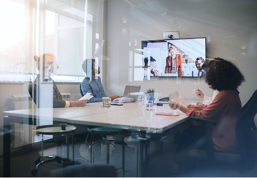 A team collaborating around a board room table.
