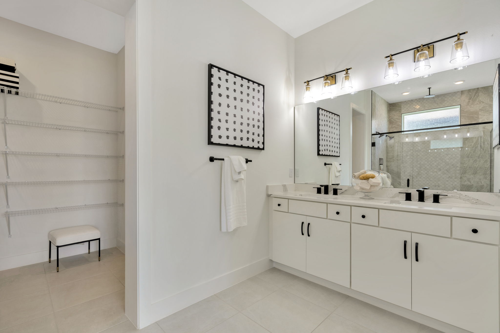 The Primary Bathroom of a DRB Homes Eider Home Plan at Biscayne Landing at Seaire in Parrish, FL.
