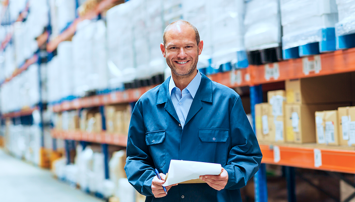A business owner working in a warehouse.