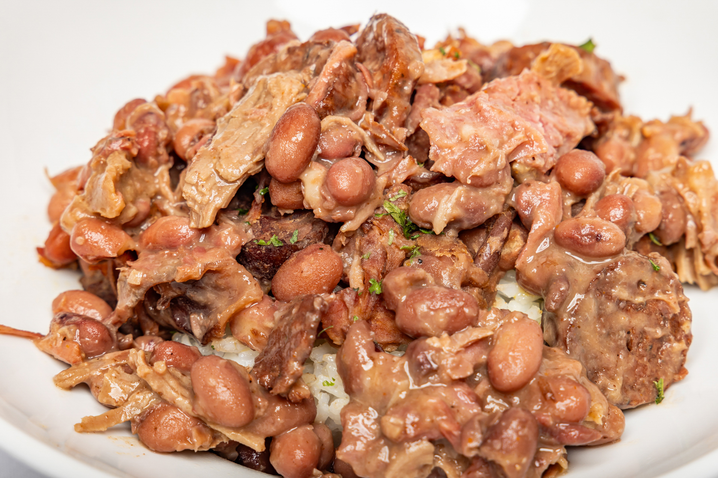 Classic slow-cooked red beans served over fluffy rice, rich in flavor and Southern comfort.