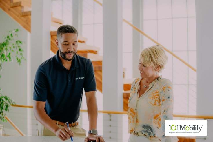 A 101 Mobility expert explains mobility equipment options to a customer during a free in home mobility consultation.