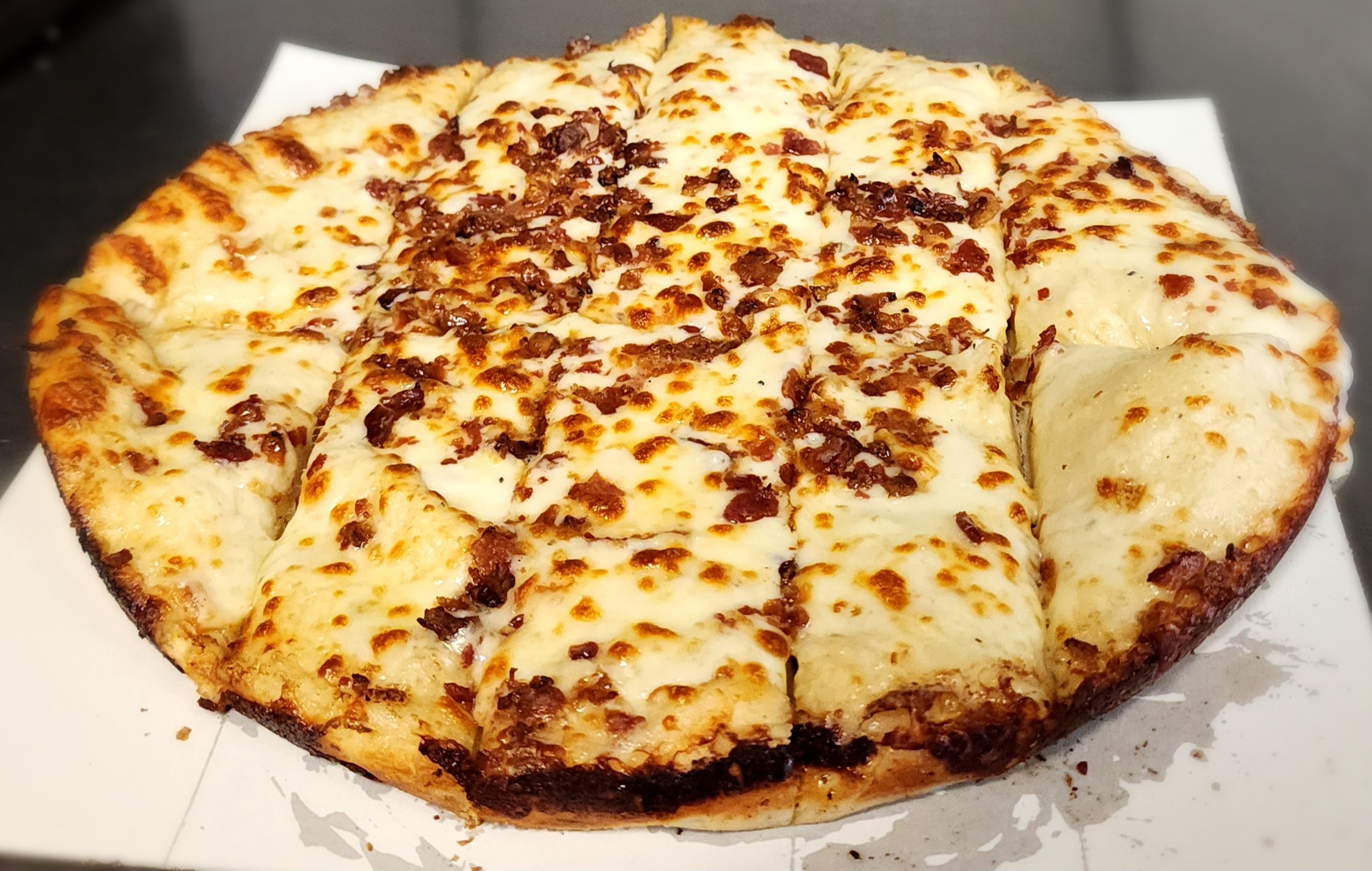 Delicious cheese sticks with ranch dressing and bacon.