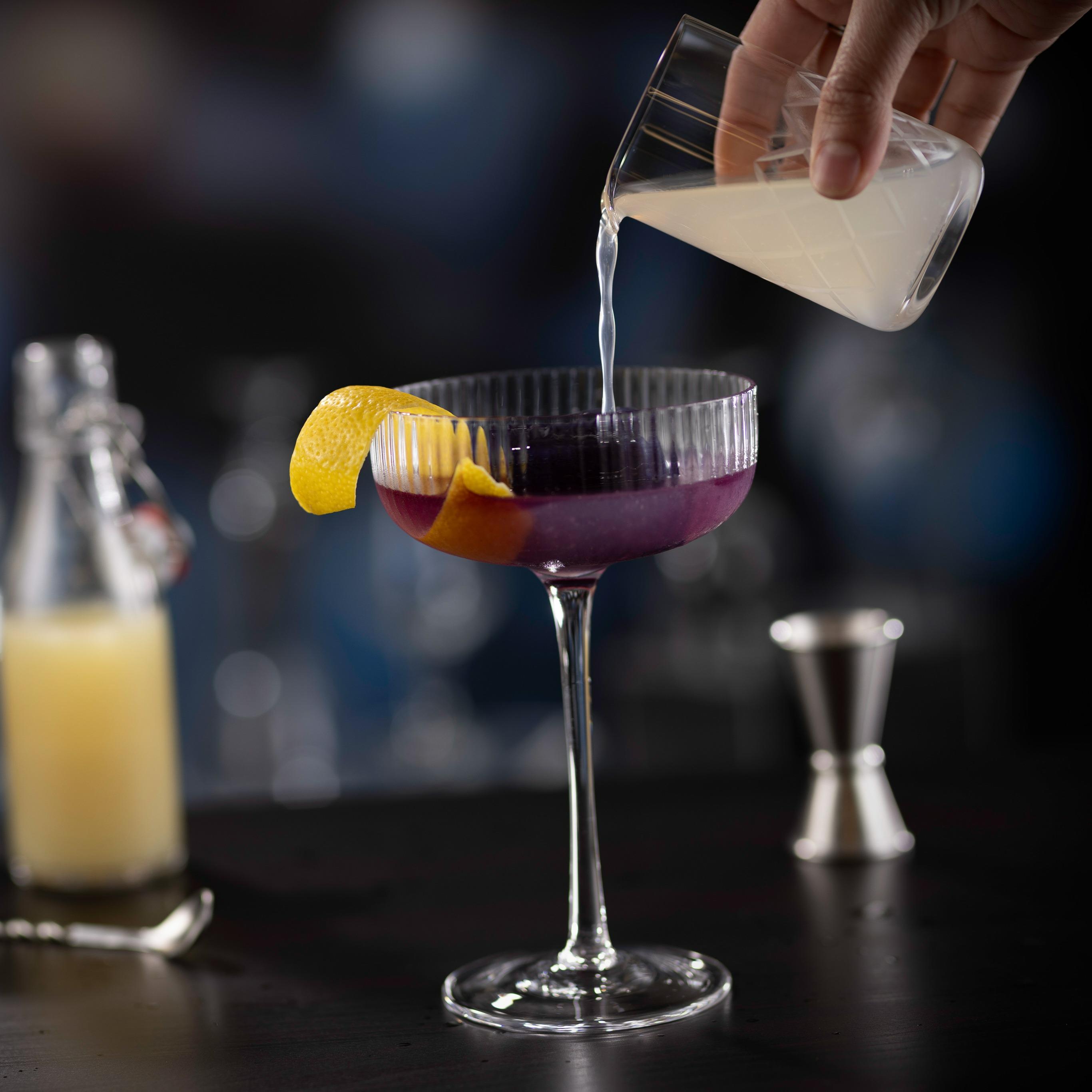 Our signature Hope Diamond Cocktail, featuring Grey Goose vodka, butterfly tea and a purple diamond ice cube