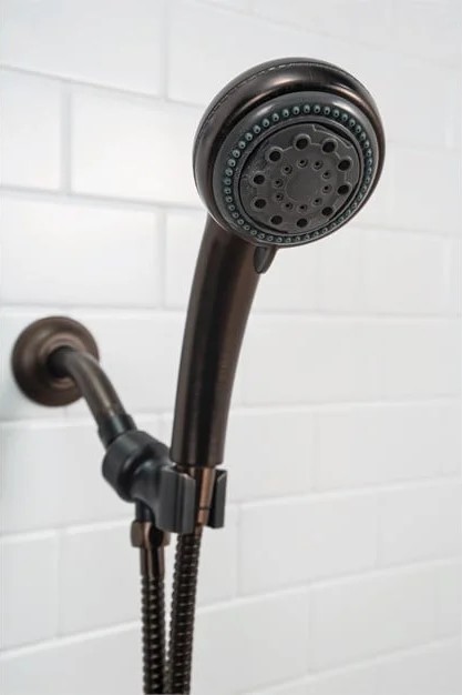 Handheld shower head with matte black finish in Portland, Maine