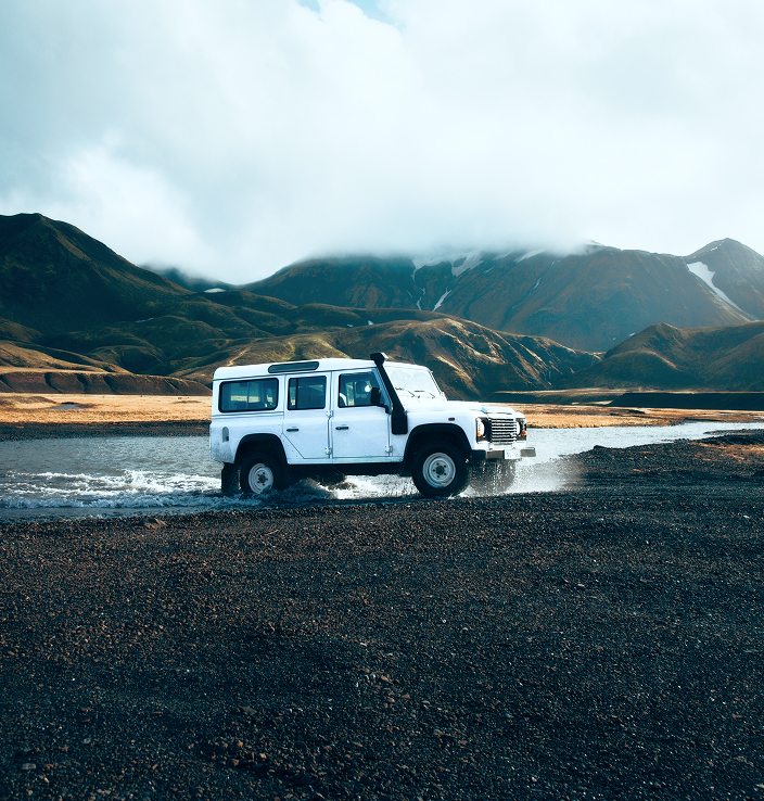 An SUV traversing rugged terrain.
