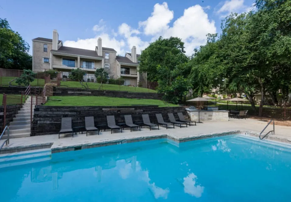 Pool with an outdoor grilling center