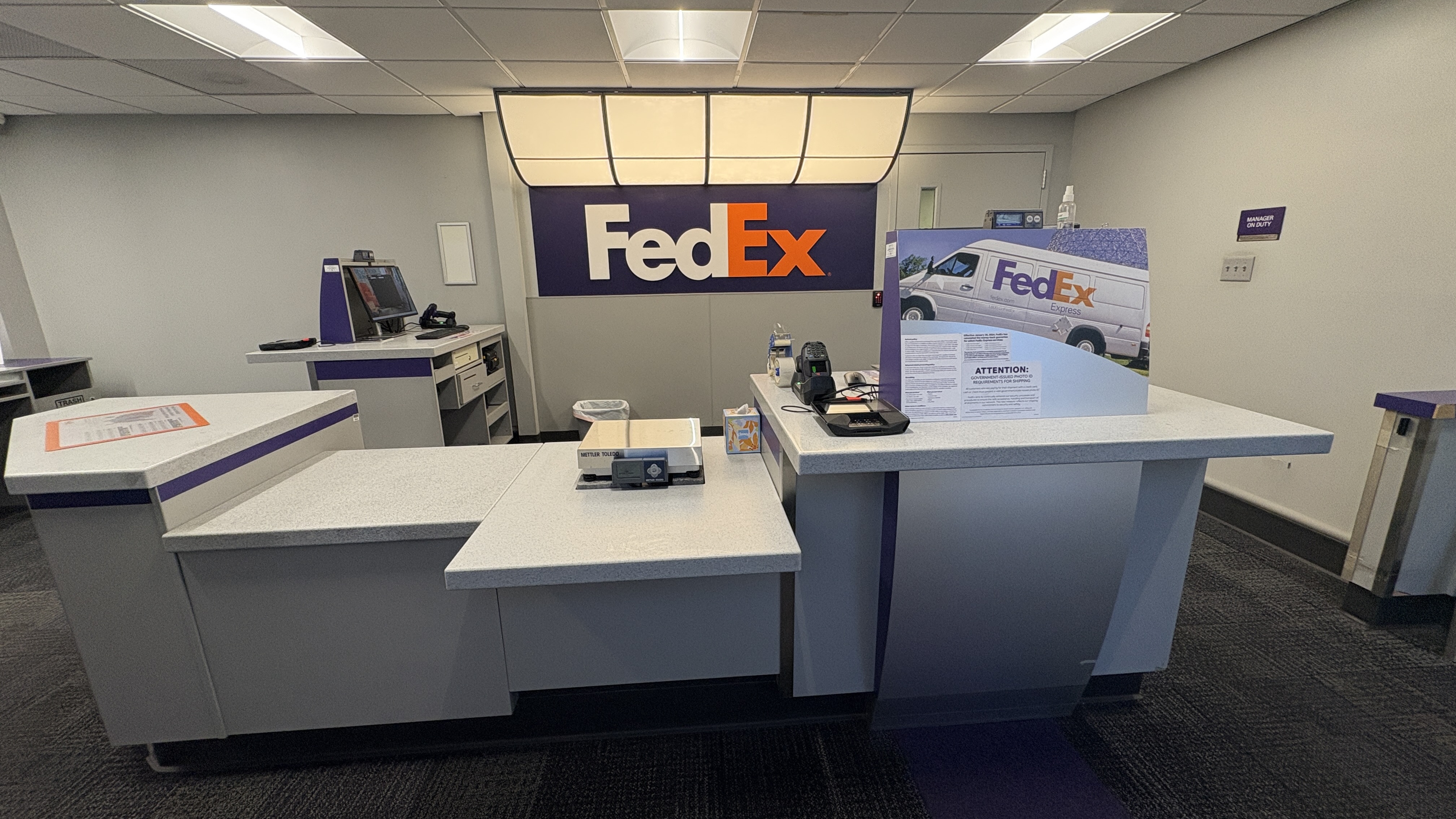 Shipping Workstation and Equipment Area &ndash; Shipping workstation with scales, supplies, and equipment at FedEx Ship Center in Lincoln Nebraska supporting package processing.