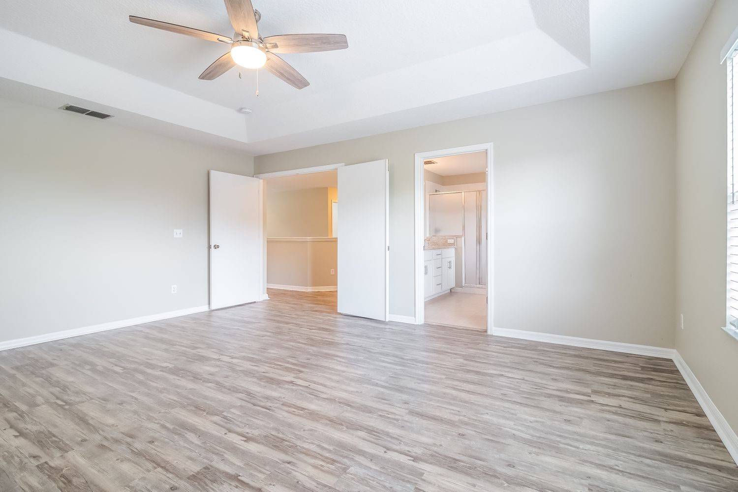 This Invitation Homes property in Orlando, FL features beautiful luxury vinyl plank flooring.