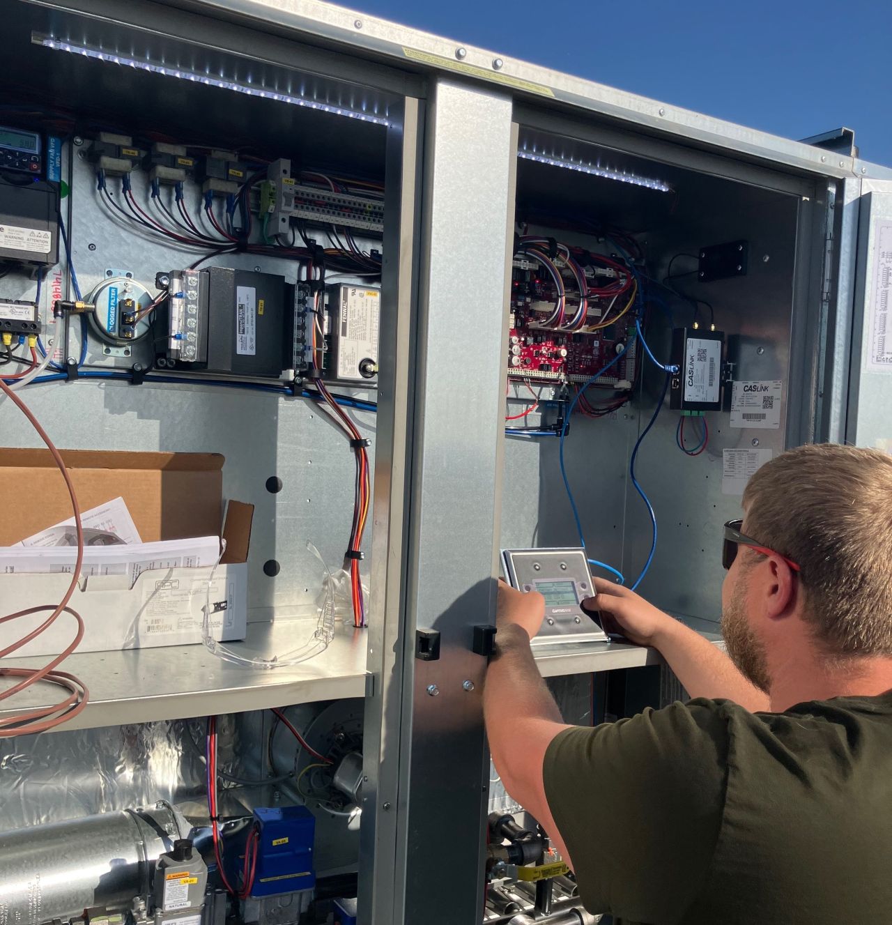 Technician configuring commercial HVAC controls